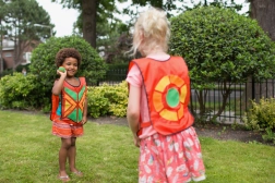 Outdoor ball-catching game with hook-and-loop vests