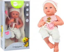 Poupée bébé en tenue blanc‑rose avec tétine et bonnet