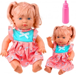 Lutka beba u šarenoj haljinici s bočicom i zvukovima