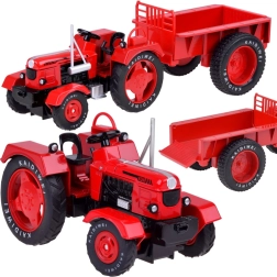 kovinski rdeč traktor s prikolico 1:18 z gumijastimi kolesi