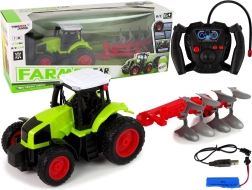 RC traktor 1:16 z gumijastimi kolesi in odstranljivim plugom