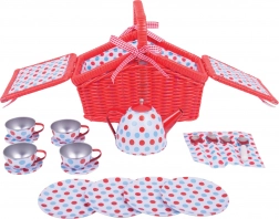 Tea set with polka dot pattern in picnic basket