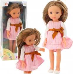 Poupée Pretty Girl en robe rose avec nœud et longs cheveux bruns