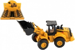 Byggemaskine læsser plast på svinghjul