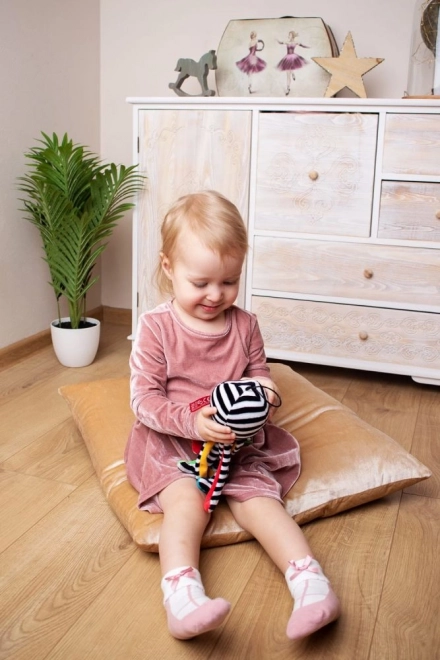 Loop for easy hanging on stroller or crib