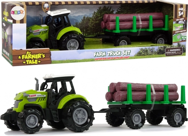 Zelený traktor s prívesom na klády so svetlom a zvukmi