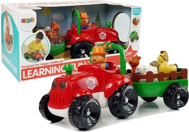 Zenélő traktor utánfutóval és állatkákban, elemes