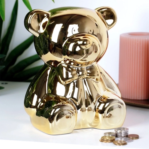 Un ourson décoratif qui apprend à épargner