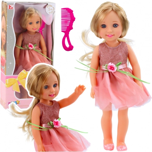 Doll in pink dress with bow and comb