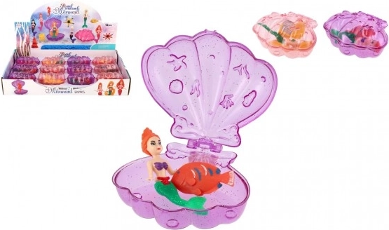 Mermaid in an opening shell with accessory, plastic 10 cm