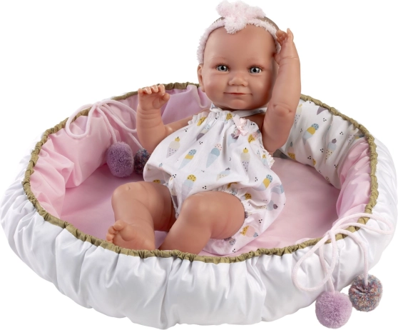 Bébé en vinyle 40 cm Nica dans un panier doux