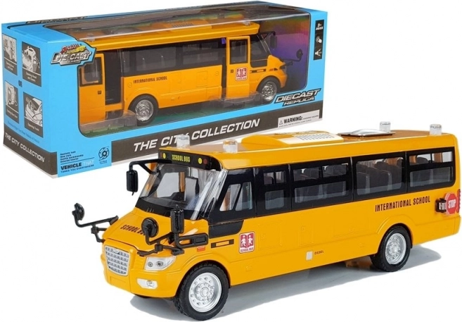 Metal school bus with pull-back drive