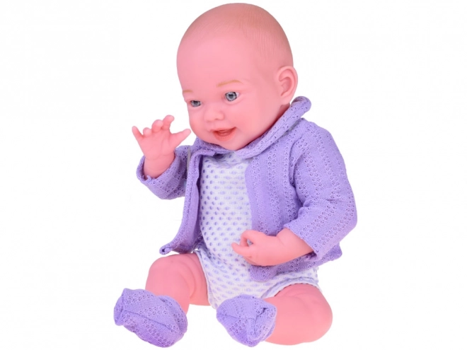 Smiling Baby Doll in Purple Sweater