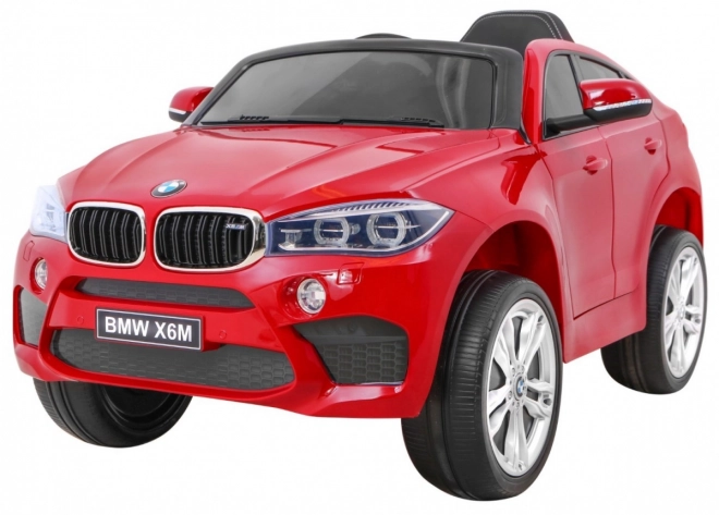 Mașină electrică pentru copii BMW X6M vopsită + telecomandă + EVA + pornire lentă + audio + LED – Červené
