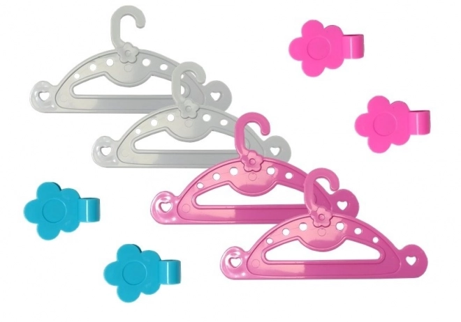 Set da stiro rosa con ferro da stiro e appendini