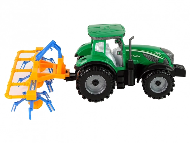 Green Tractor with Friction-Driven Hay Rake