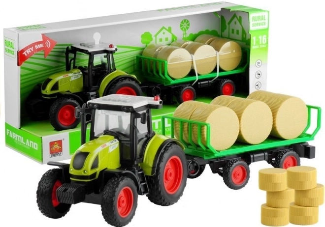 Zelený traktor s prívesom na seno so svetlami a zvukmi