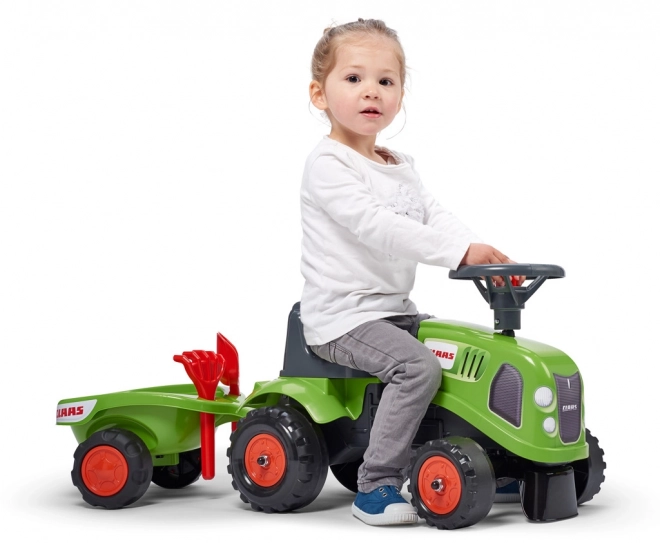 ride-on toy tractor with trailer and gardening tools