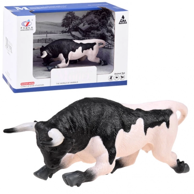 Black and White Bull Figurine Ready to Charge