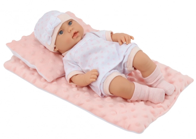 Baby Doll in White Pajamas with Blanket and Pillow