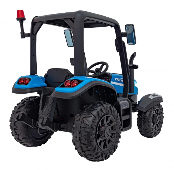 Kindertraktor mit blauem Anhänger