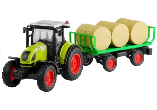 Zelený traktor s prívesom na seno so svetlami a zvukmi