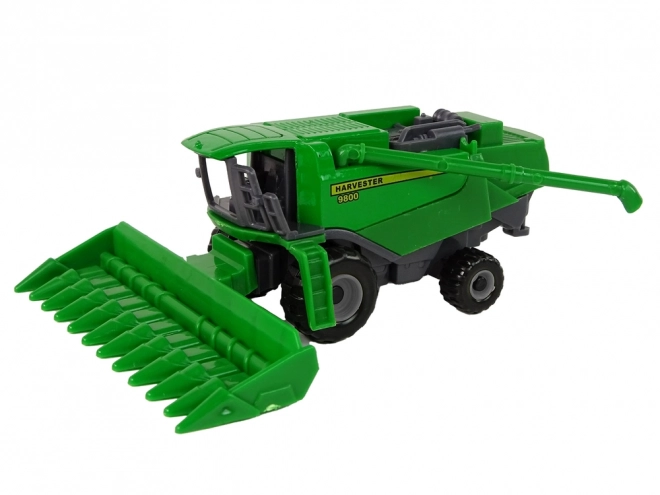 Green and Yellow Toy Farm Tractor with Seeder