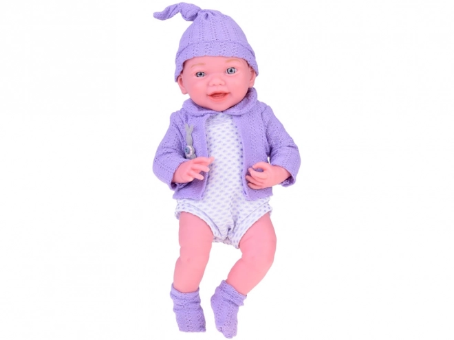 Smiling Baby Doll in Purple Sweater