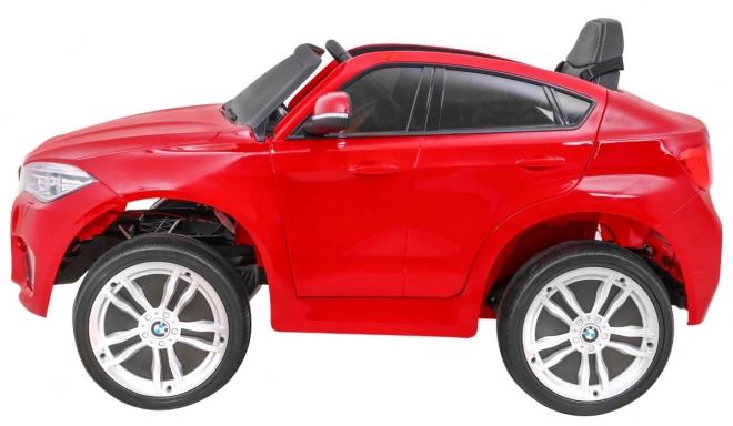 Mașină electrică pentru copii BMW X6M vopsită + telecomandă + EVA + pornire lentă + audio + LED – Červené