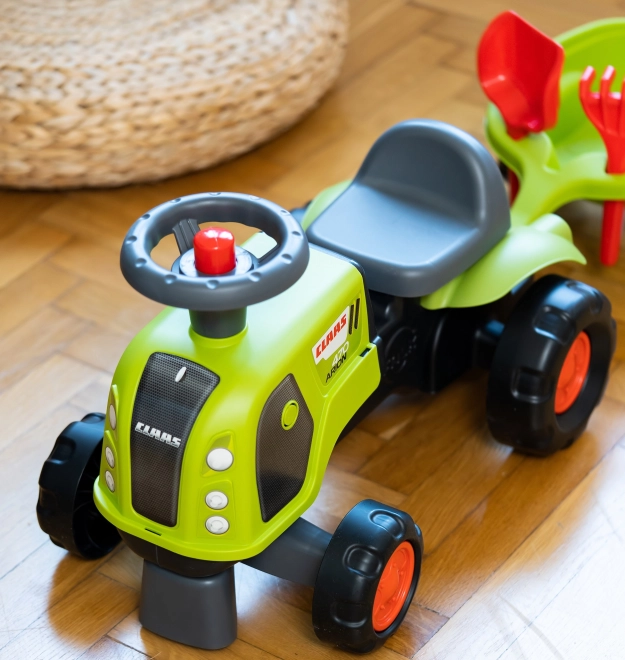Trattore a spinta Claas Arion con rimorchio e set per la sabbia