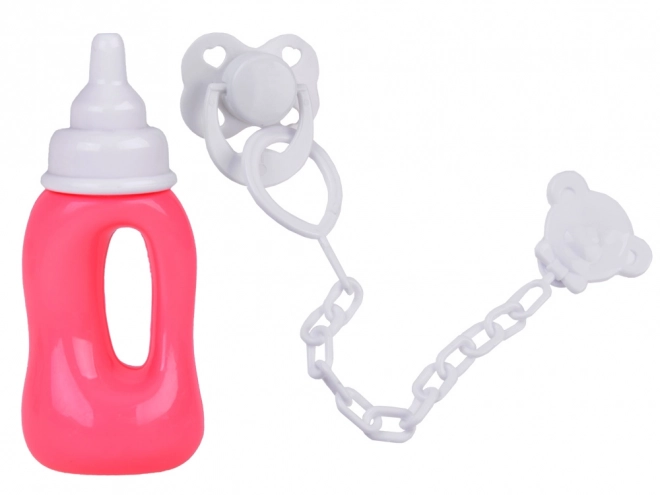 Rubber Baby Doll in Pink Dress with Bottle and Pacifier