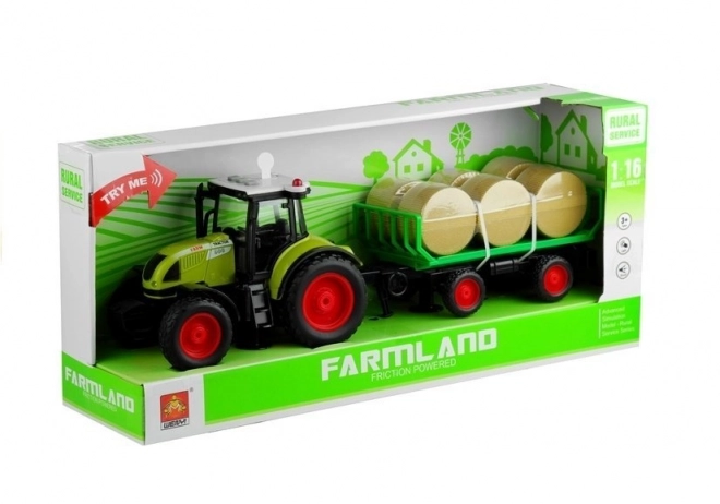 Zelený traktor s prívesom na seno so svetlami a zvukmi
