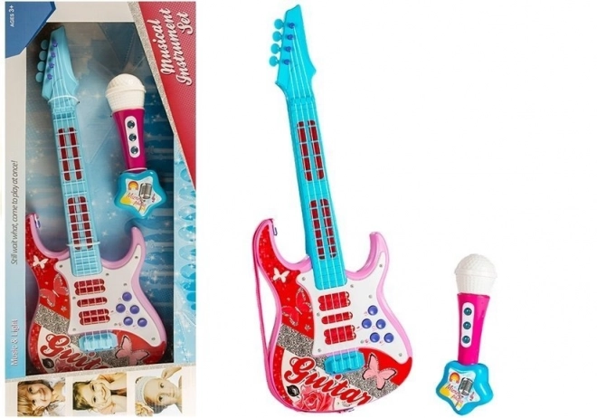 pink toy electric guitar with microphone and strings