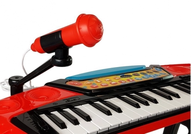 Red 37-key keyboard with stand and seat