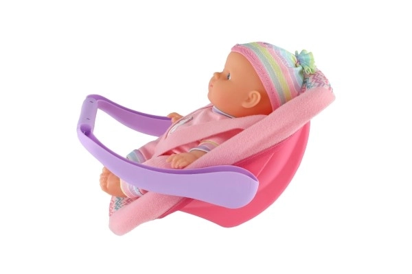 Doll With 20 Cm Plastic Body In Carrier/Car Seat