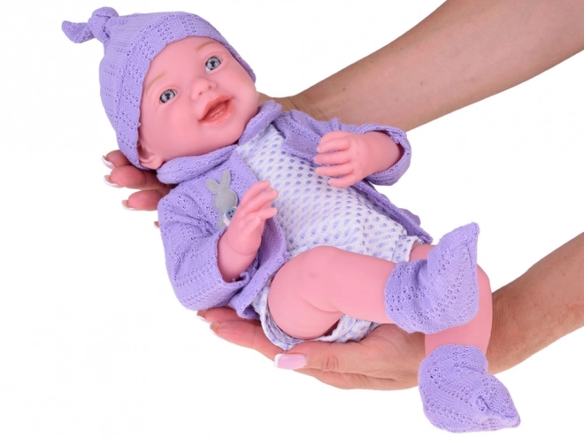 Smiling Baby Doll in Purple Sweater