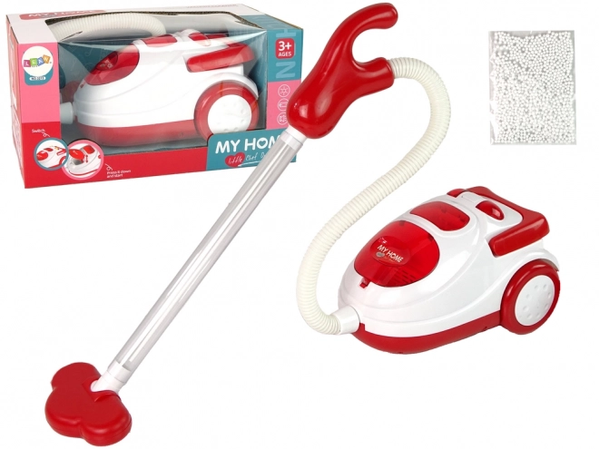 Red Children's Toy Vacuum with Styrofoam Balls