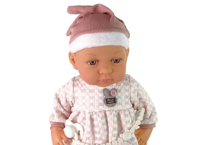 Baby Doll with Pink Pacifier and Feather Blanket