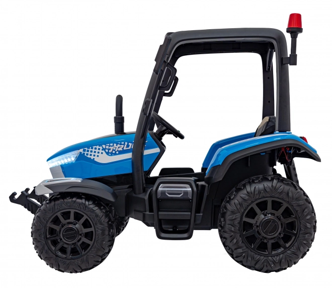 Kindertraktor mit blauem Anhänger
