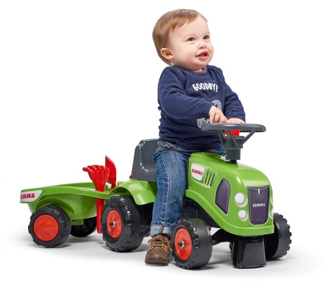 ride-on toy tractor with trailer and gardening tools