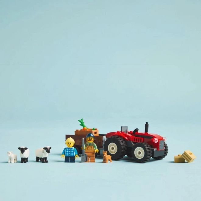 red tractor with trailer and sheep