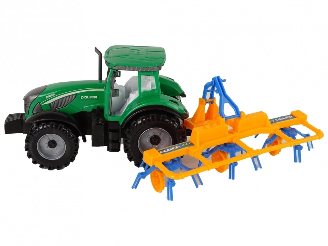 Green Tractor with Friction-Driven Hay Rake