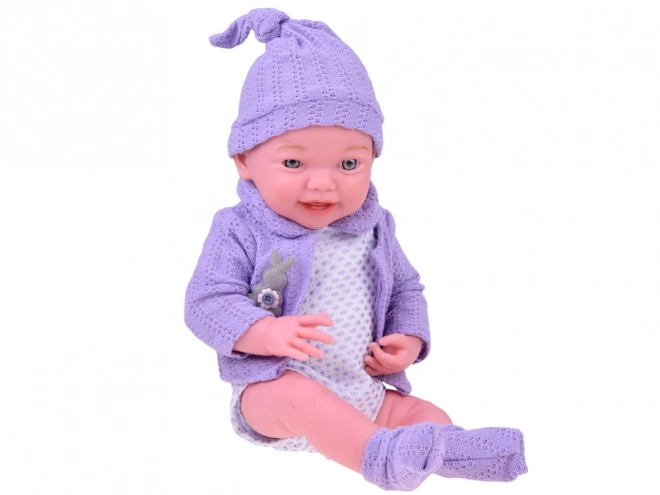 Smiling Baby Doll in Purple Sweater