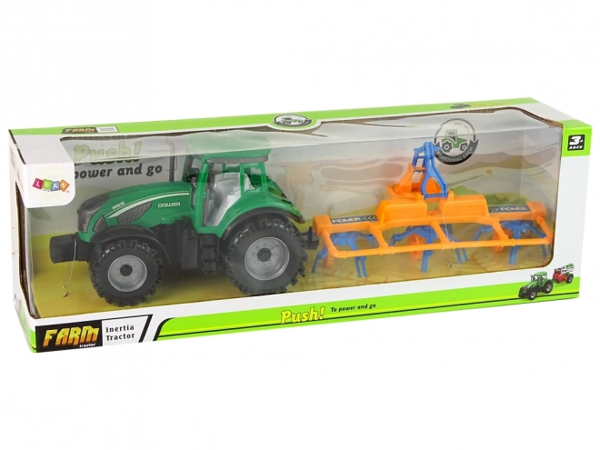 Green Tractor with Friction-Driven Hay Rake