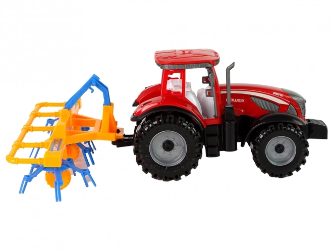 Red Tractor with Rake Friction Drive