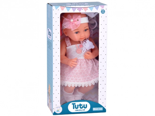 Rubber Baby Doll in Pink Dress with Bottle and Pacifier