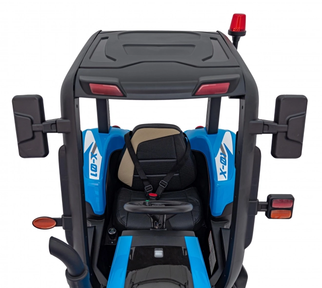 Kindertraktor mit blauem Anhänger