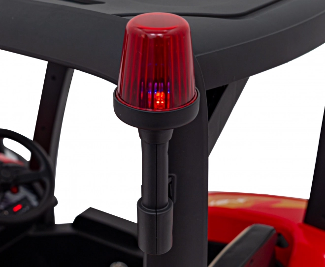 Traktor s přívěsem červený