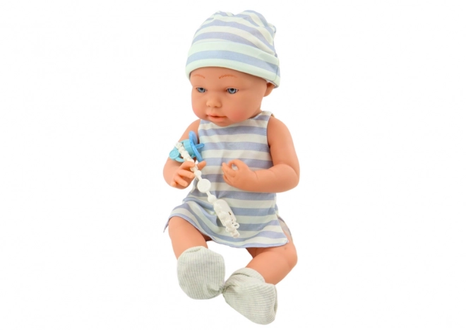 Baby Doll in White and Blue Outfit with Hat and Pacifier