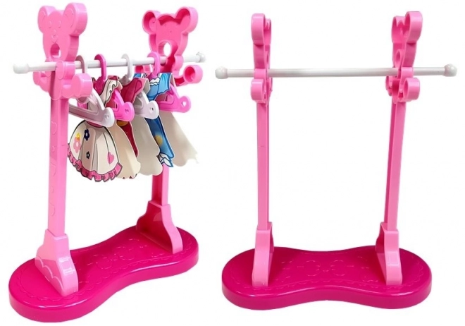 Set da stiro rosa con ferro da stiro e appendini
